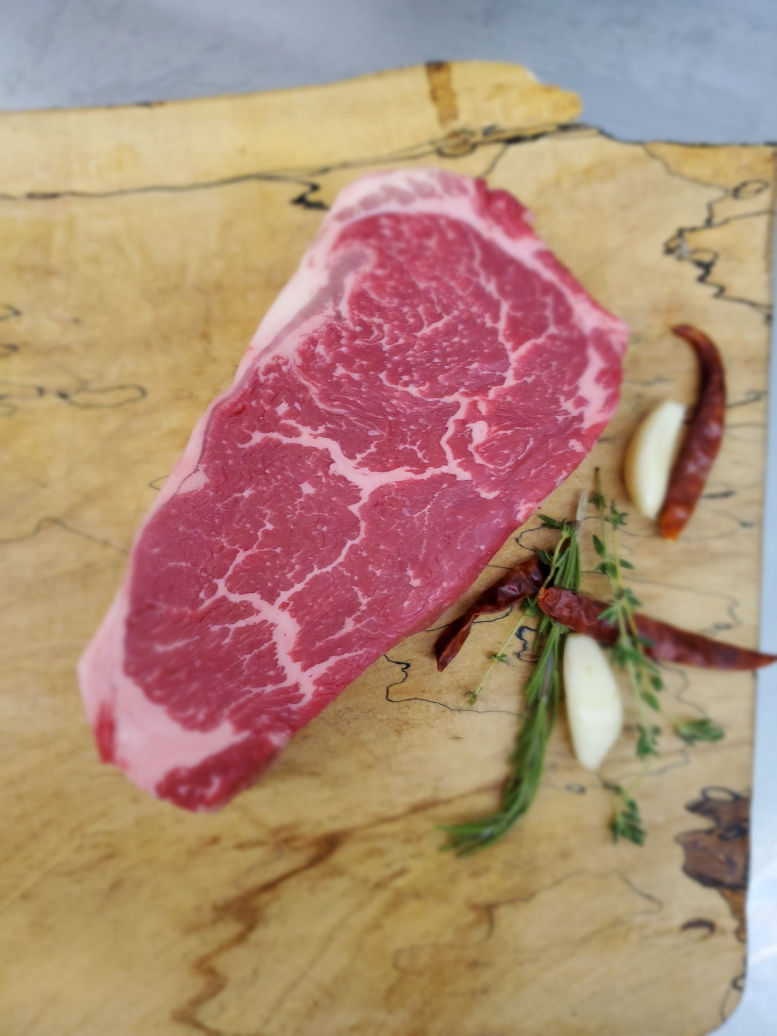 (1) Barley Fed F1 Wagyu New York (Boneless) MBS4 (16oz)